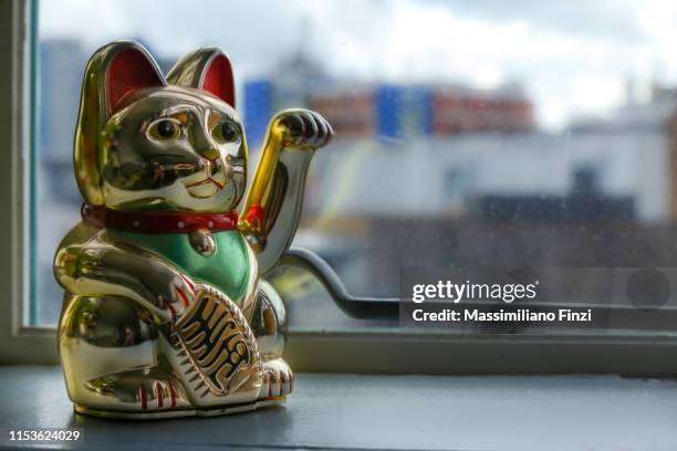 the lucky japanese cat, maneki-neko. - luck stock pictures, royalty-free photos & images