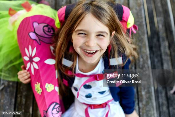 portrait of happy little girl with school cone - first day of school bildbanksfoton och bilder