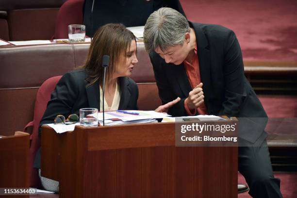 Senator Jacqui Lambie, leader of the Jacqui Lambie Network Party from Tasmania, left, speaks to Senator Penny Wong, leader of the opposition, during...