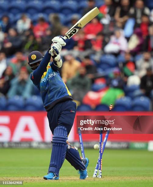 Isuru Udana of Sri Lanka is bowled by Dawlat Zadran of Afghanistan during the Group Stage match of the ICC Cricket World Cup 2019 between Afghanistan...