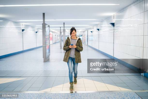 smiling woman at the hamburg metro - metro hamburg stock pictures, royalty-free photos & images