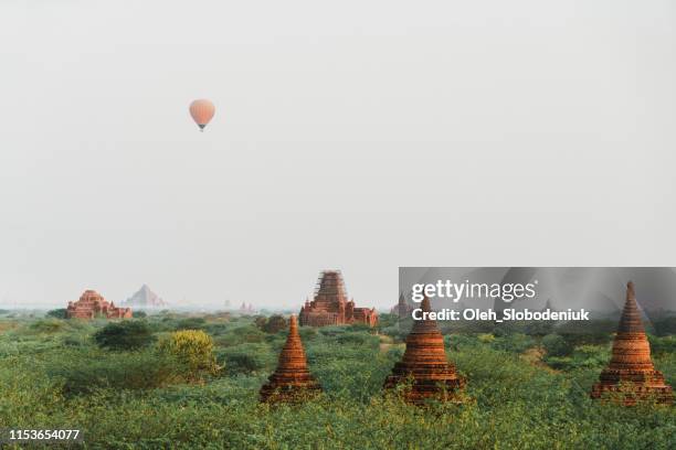 scenic view of hot air balloons above  bagan heritage site - angkor wat balloon stock pictures, royalty-free photos & images