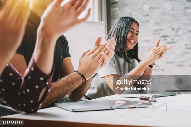 closeup photo of partners clapping hands after business seminar - clapping stock pictures, royalty-free photos & images