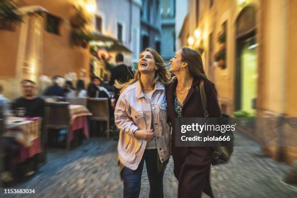 tourist women enjoy night life in rome - rome nightlife stock pictures, royalty-free photos & images