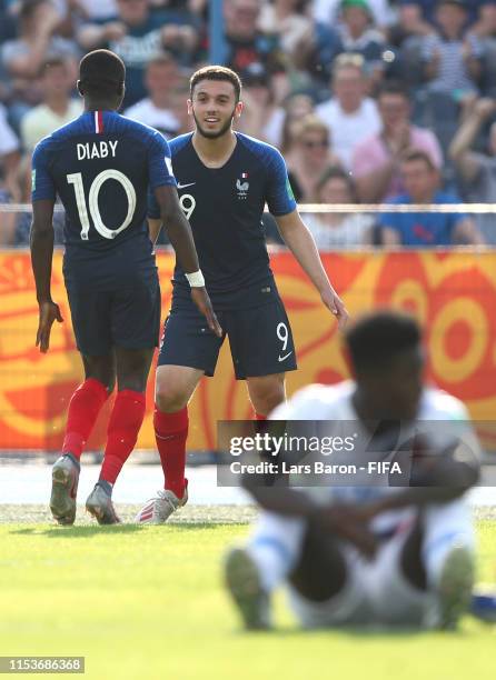 Amine Gouiri of France celebrates after scoring his team's first goal with team mate Moussa Diaby during the 2019 FIFA U-20 World Cup Round of 16...