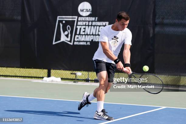 Rrezart Cungu of the Wake Forest Demon Deacons hits a backhand against the Texas Longhorns during the Division I Men's Tennis Championship held at...