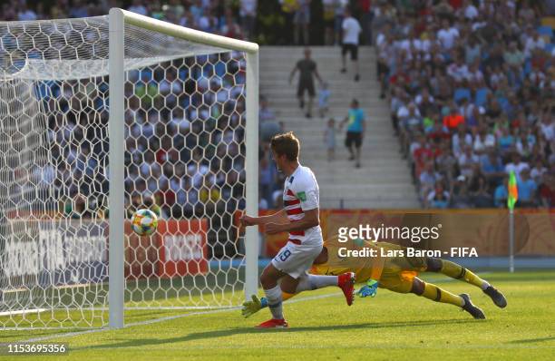 Justin Rennicks of the United States scores his team's third goal past Alban Lafont of France during the 2019 FIFA U-20 World Cup Round of 16 match...