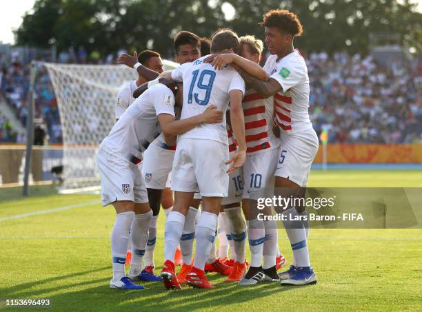 Justin Rennicks of the United States celebrates as he scores his team's third goal with with team mates during the 2019 FIFA U-20 World Cup Round of...