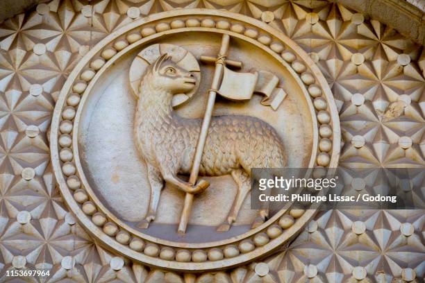 detail of the danish church lamb of god tympanum, jerusalem, israel. - lamb of god stock pictures, royalty-free photos & images
