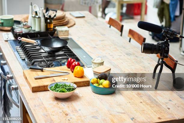 kitchen counter set up with video camera and fresh ingredients - kitchen bench stock pictures, royalty-free photos & images
