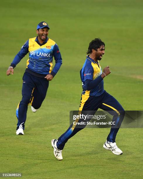 Sri Lanka bowler Nuwan Pradeep celebrates with team mates after bowling Rashid Khan of Afghanistan during the Group Stage match of the ICC Cricket...