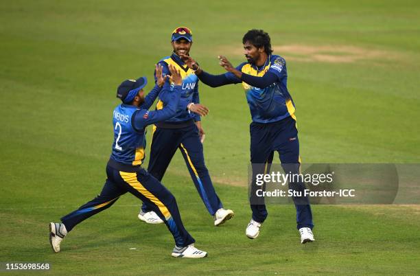 Sri Lanka bowler Nuwan Pradeep celebrates with team mates after bowling Rashid Khan of Afghanistan during the Group Stage match of the ICC Cricket...