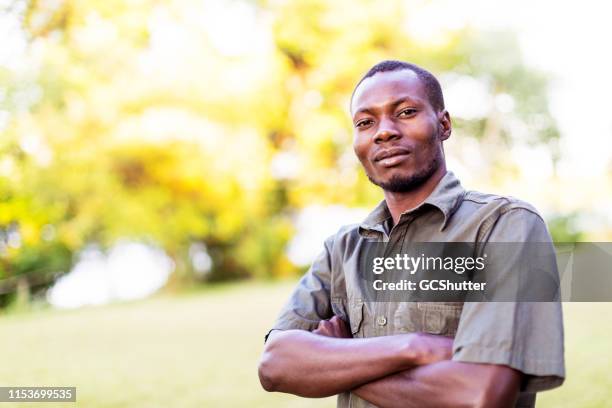 portrait of a confident forest ranger in africa - lusaka stock pictures, royalty-free photos & images