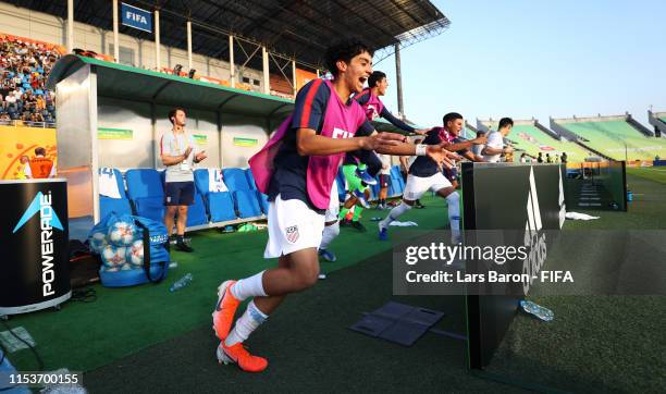 Richard Ledezma of the United States and team mates celebrate victory after the 2019 FIFA U-20 World Cup Round of 16 match between France and USA at...