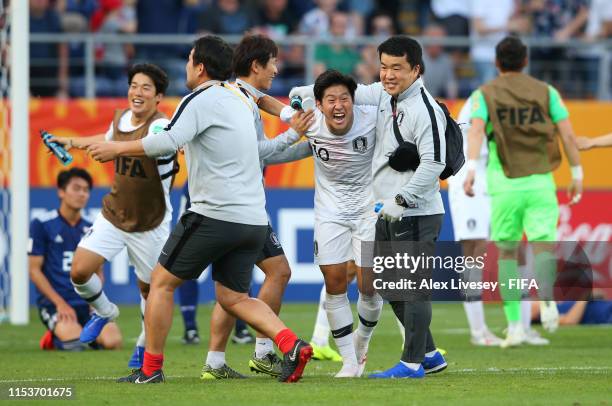 Kangin Lee of Korea Republic celebrates victory with team mates and staff after the 2019 FIFA U-20 World Cup Round of 16 match between Japan and...