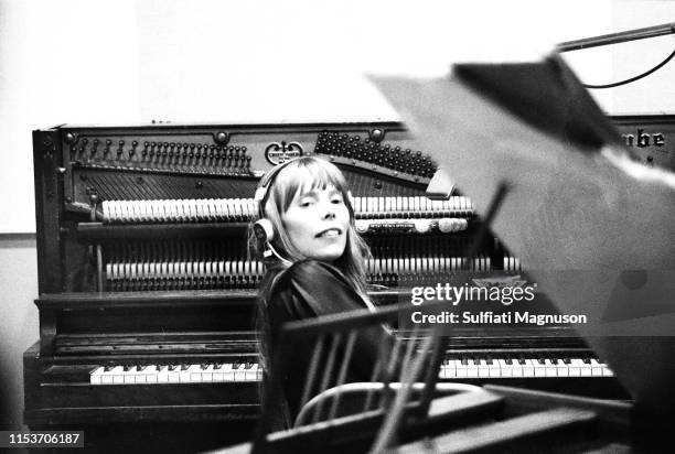 Musician Joni Mitchell recording her first album "Song to a Seagull" at Sunset Sound Recorders in 1967 in Los Angeles, California.