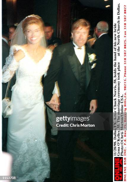 Dallas,TX. Actor Chuck Norris holds the hand of his new bride Gena O''Kelley, 35. The marriage ceremony took place at the North Church in Dallas.