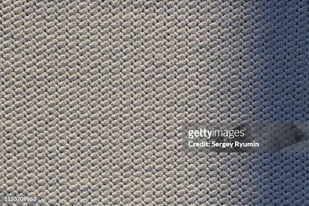 close-up of cotton crochet knitting with a shadow - needlecraft stock-fotos und bilder
