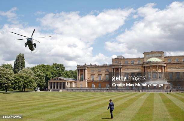 Marine One, the United States Marine Corps Helicopter, carrying U.S. President Donald Trump and Melania Trump comes in to land in the garden of...