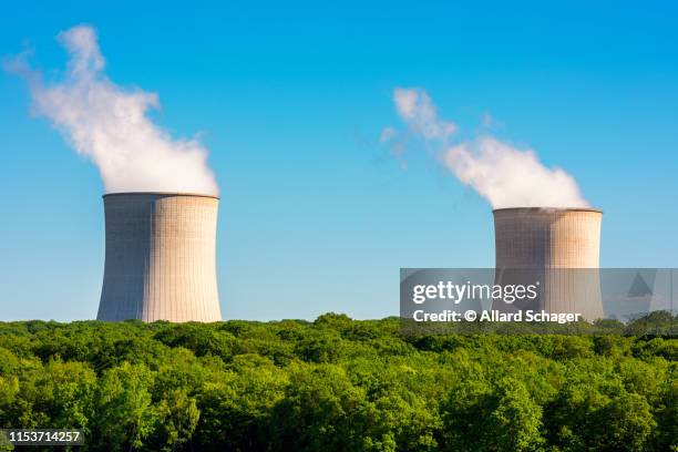 steaming cooling towers at nuclear power plant - cooling tower stock pictures, royalty-free photos & images