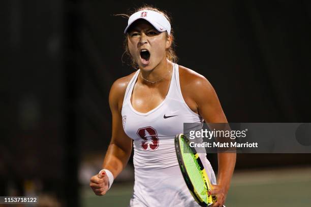 Caroline Lampl of the Stanford Cardinal celebrates a point against the Georgia Bulldogs during the Division I Women's Tennis Championship held at the...
