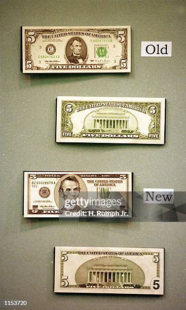 The redesigned $5 bill, which was unveiled at the Treasury Department in Washington November 16, 1999. The redesigned $5 and $10 bills have several...