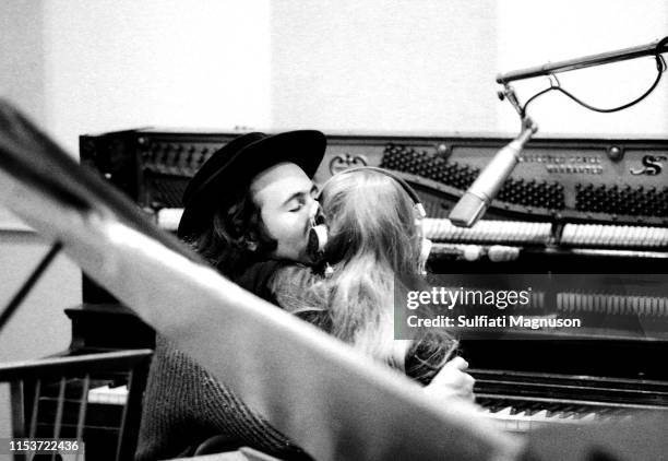 Musician Joni Mitchell gets a smooch from her beau and producer David Crosby while recording her first album "Song to a Seagull" at Sunset Sound...