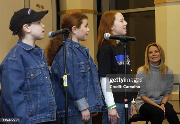 Ed Dixon, Andrew Zutty, Alexis Ehrlich and Maggie Watts sing songs from "The Family Under the Bridge" while Kathie Lee Gifford looks on