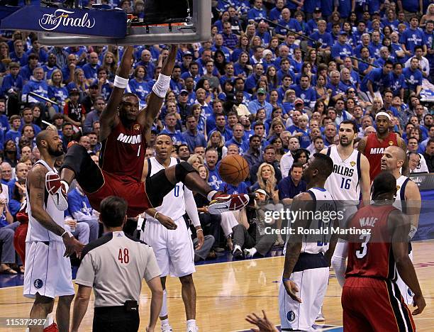 Chris Bosh of the Miami Heat dunks the ball while taking on the Dallas Mavericks in Game Three of the 2011 NBA Finals at American Airlines Center on...