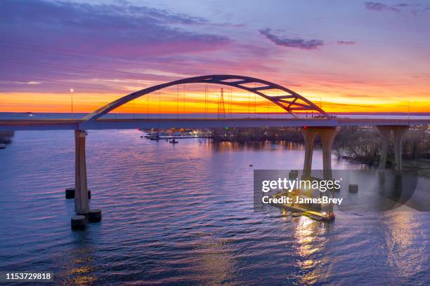 barge under scenic bridge at daybreak - v wisconsin stock pictures, royalty-free photos & images