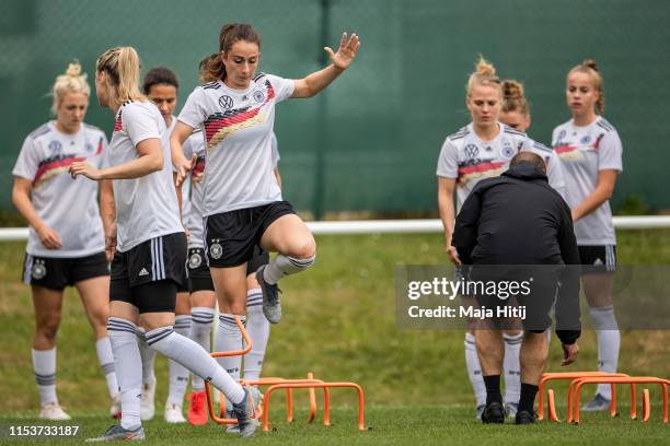 Sara Daebritz jumps during a training session of the German women's national football team on June 04, 2019 in Bruz, France. Germany will play their...