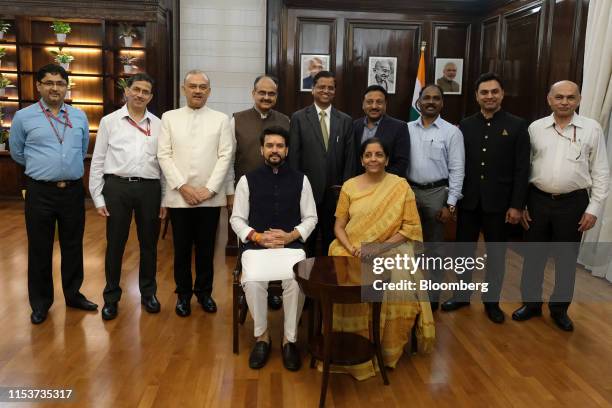 Nirmala Sitharaman, India's finance minister, center right, sits beside Anurag Thakur, India's finance and corporate affairs minister, during the...