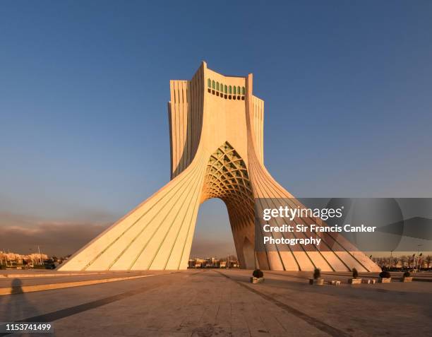 azadi tower under the last rays of sunlight in tehran, iran - tehran skyline stock pictures, royalty-free photos & images