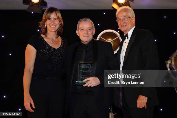 Autobiography of the Year winner Paul Ferris receives his award from Katherine Grainger and David Gower at the Sports Book Awards at Lord's Cricket...