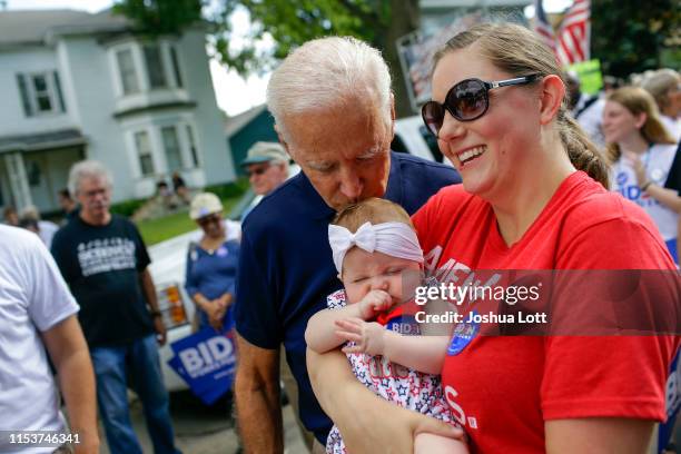 Democratic presidential candidate, former Vice President Joe Biden kisses Ashley Blasberg on her head as her mother Erin Blasberg looks on during the...