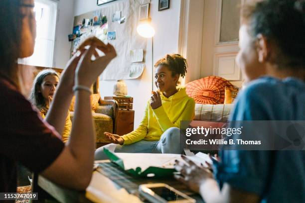 pizza party with teenage friends - share house stock pictures, royalty-free photos & images