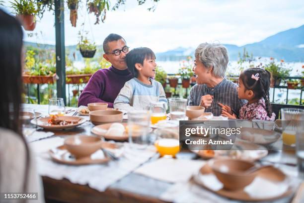grandparents and grandchildren enjoying weekend - hong kong grandmother stock pictures, royalty-free photos & images