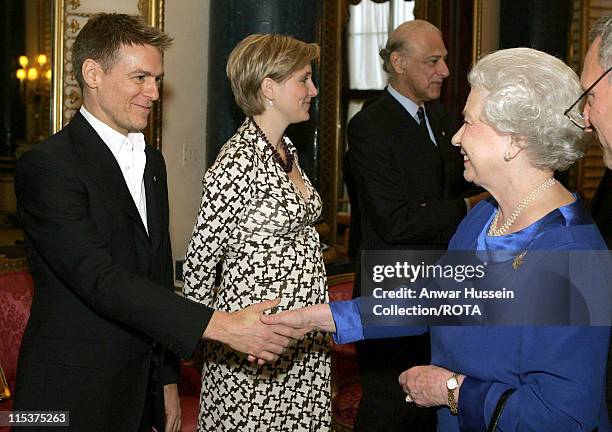 The Queen Elizabeth II meets singer and guitarist Bryan Adams at a reception for talented Canadians at Buckingham Palace, London, Tuesday May 3, 2005.