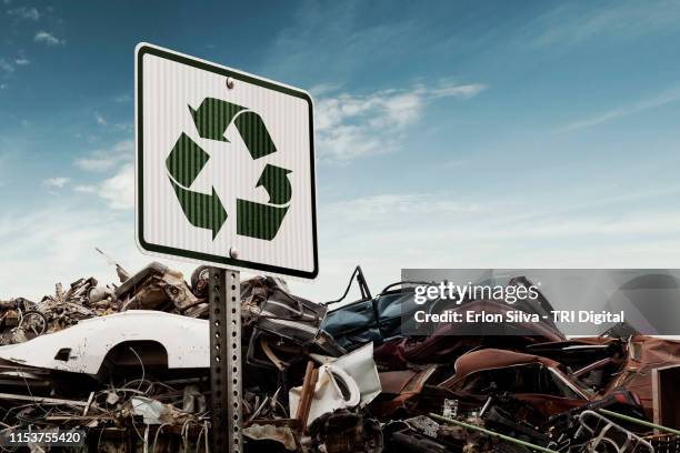 scrap metal recycling yard of crushed cars - sucata imagens e fotografias de stock