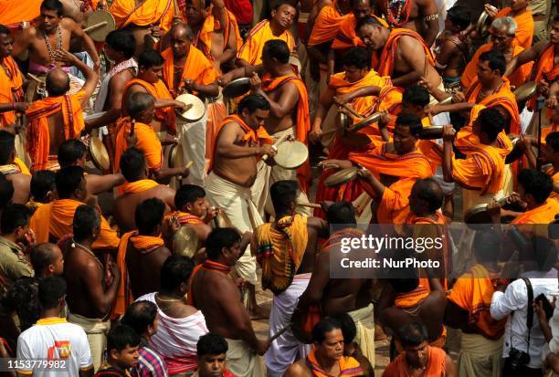 Devotees are seen on the grand road in front of Shree Jagannath temple as temple ditties comes out from the temple in the grand procession to ride...