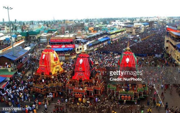 Devotees are seen on the grand road in front of Shree Jagannath temple as temple ditties comes out from the temple in the grand procession to ride...