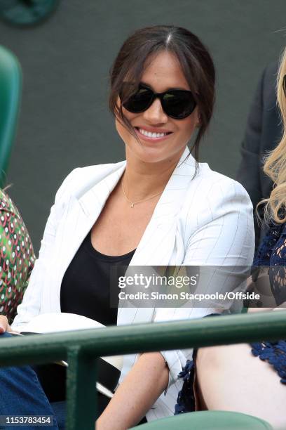 Meghan, Duchess of Sussex looks on as Serena Williams plays Kaja Juvan in their Ladies' Singles 2nd Round match on Day 4 of The Championships -...