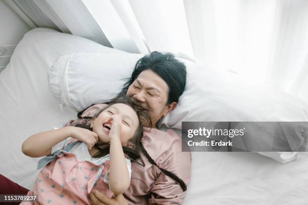 laughing together with happiness moment - grandma sleeping stock pictures, royalty-free photos & images