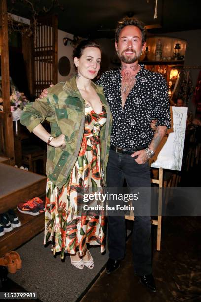 Fashion designer Lena Hoschek and fashion designer Marcel Ostertag during the Umami after show dinner on July 4, 2019 in Berlin, Germany.