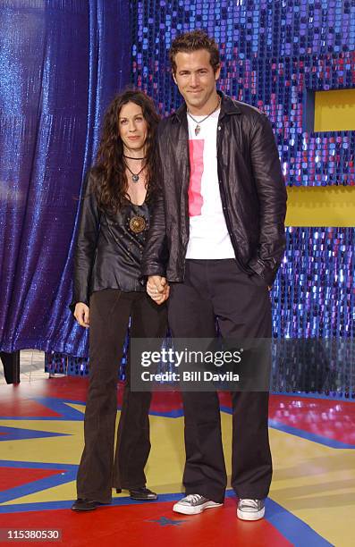 Alanis Morissette and Ryan Reynolds during 2003 MTV Movie Awards - Arrivals at The Shrine Auditorium in Los Angeles, California, United States.