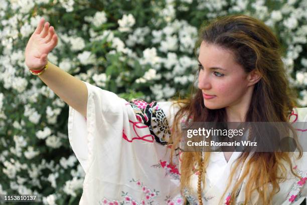 young woman in kimono with outstretched arm - teenage girl tai chi stock pictures, royalty-free photos & images