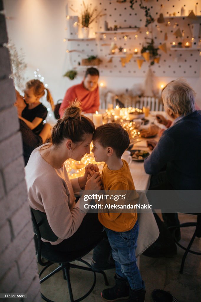 Kids during Christmas dinner with their family