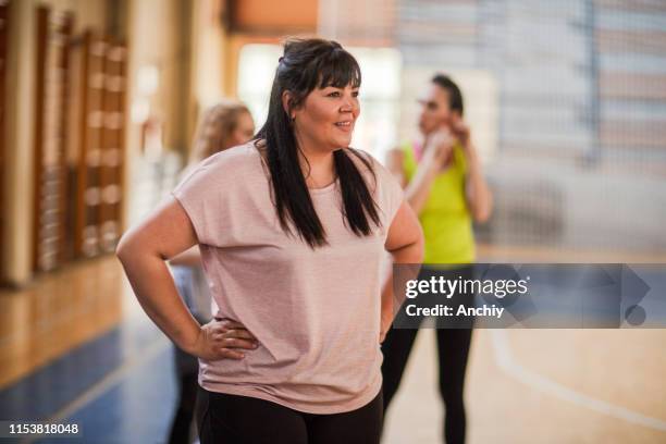 woman relaxing after dance class - fat woman dancing stock pictures, royalty-free photos & images