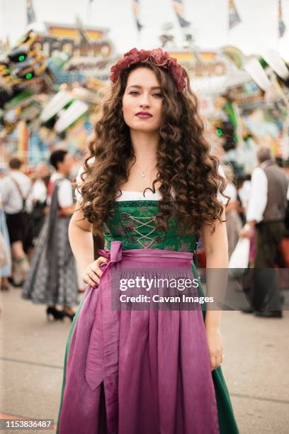 young woman with long curly hair in beer fest dress - dirndl stock-fotos und bilder
