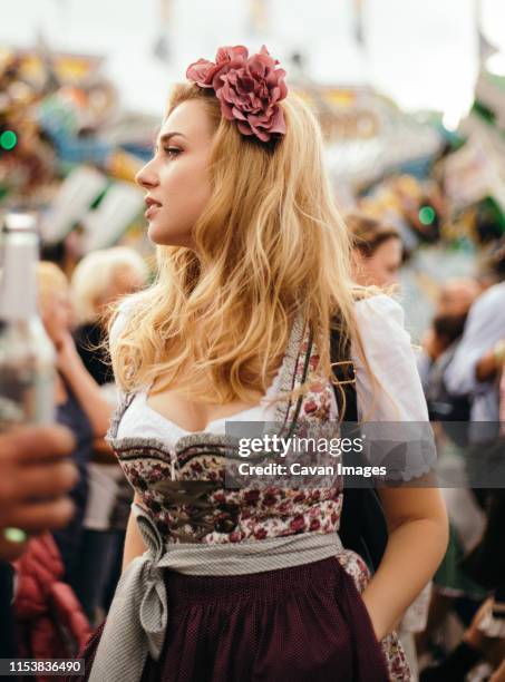 young blond beautiful woman in beer fest dress - dirndl stock-fotos und bilder